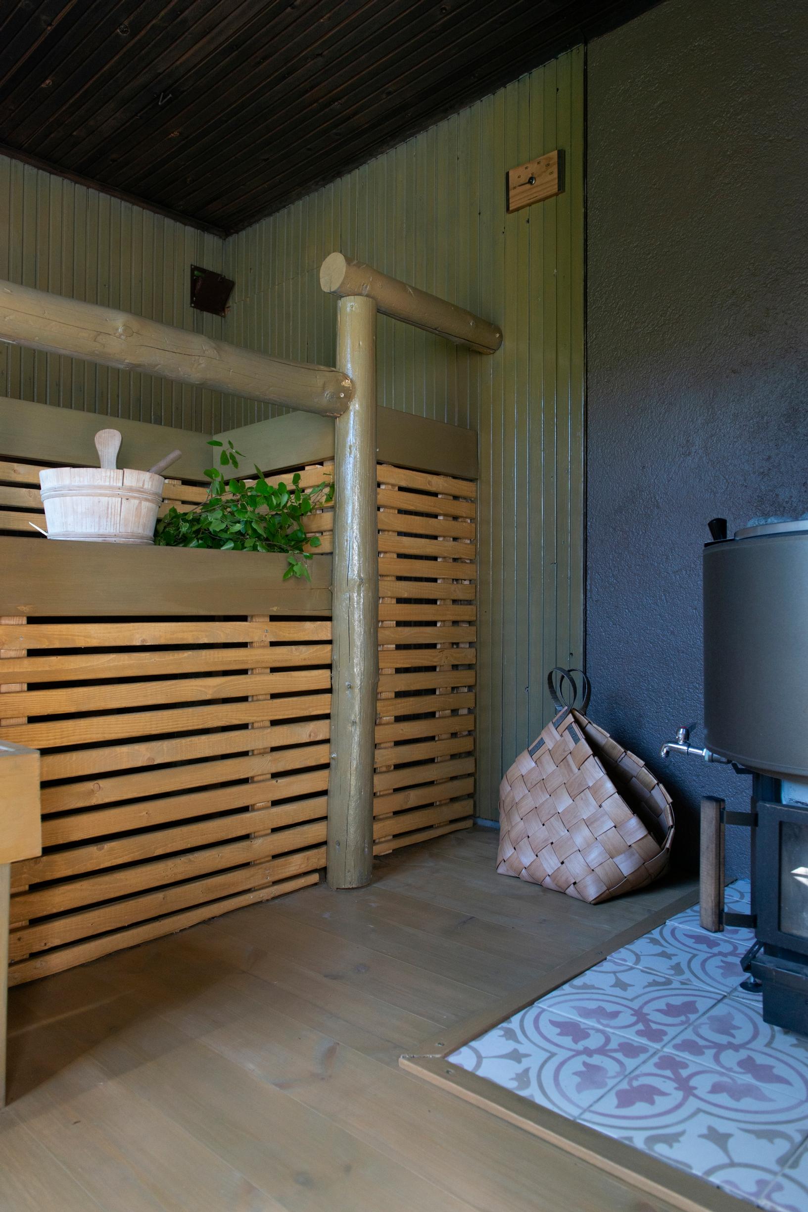 Renovated yard sauna with stove and benches