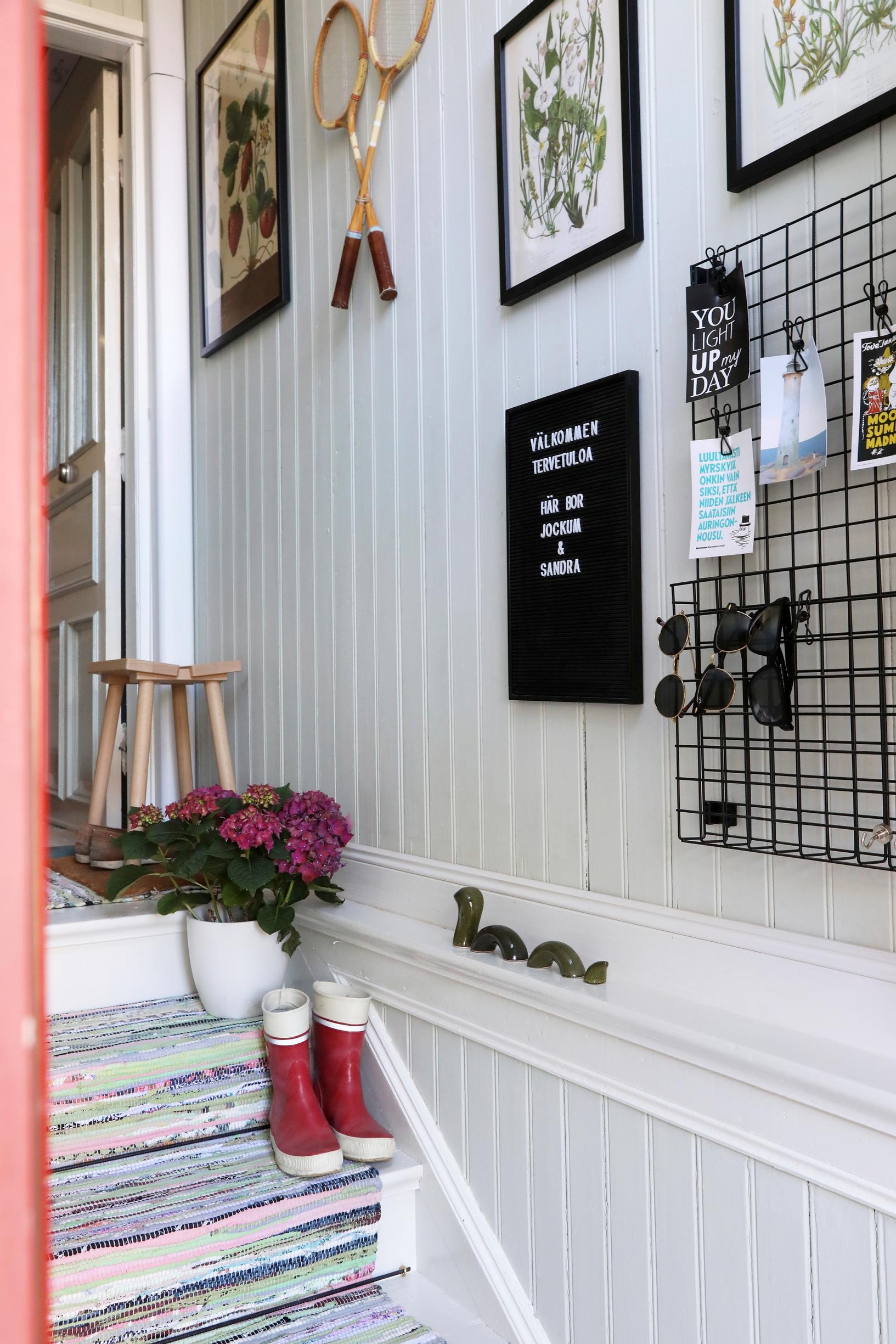 Entryway with a rag rug and stairs
