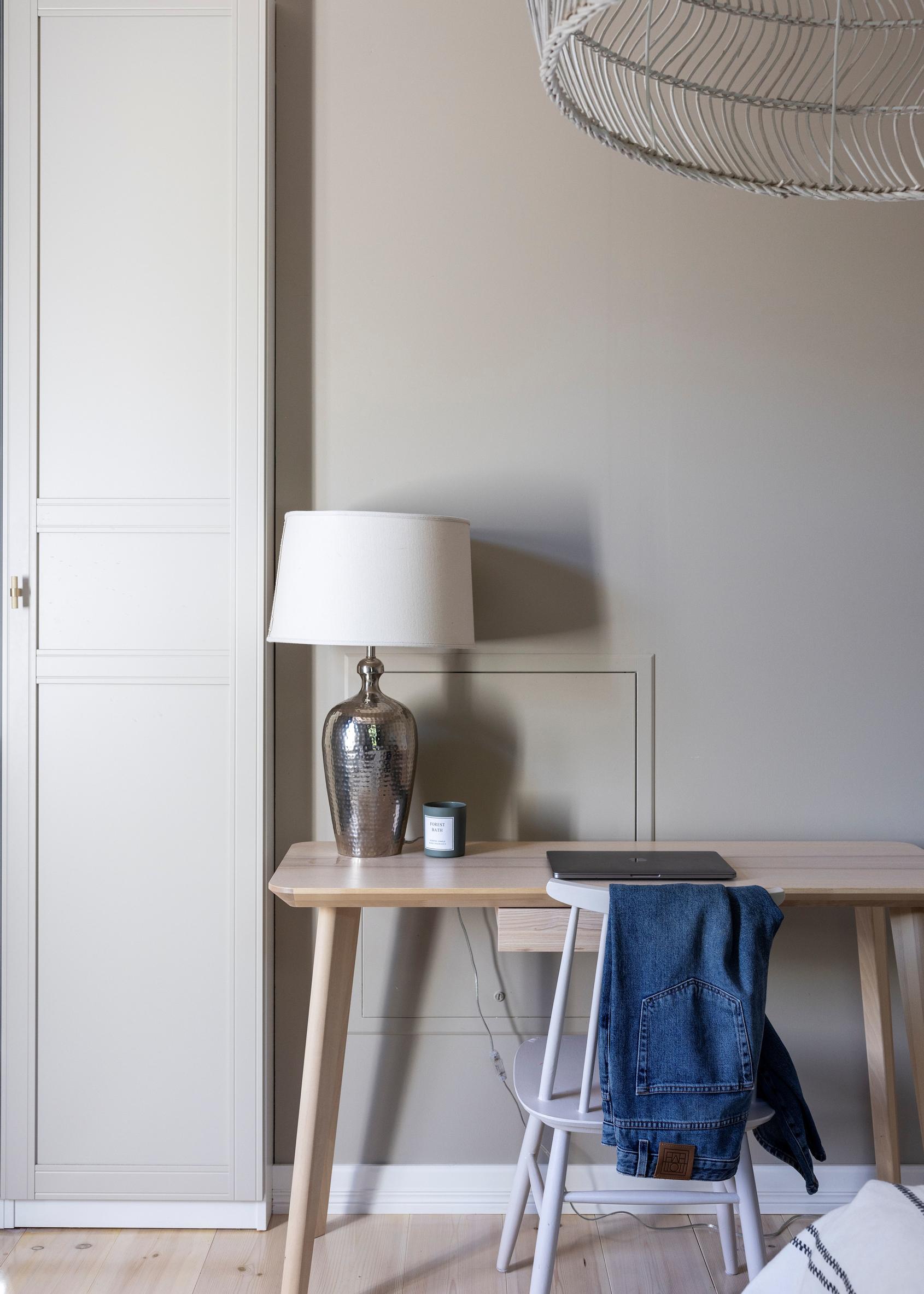 A closet in the bedroom and a wooden desk