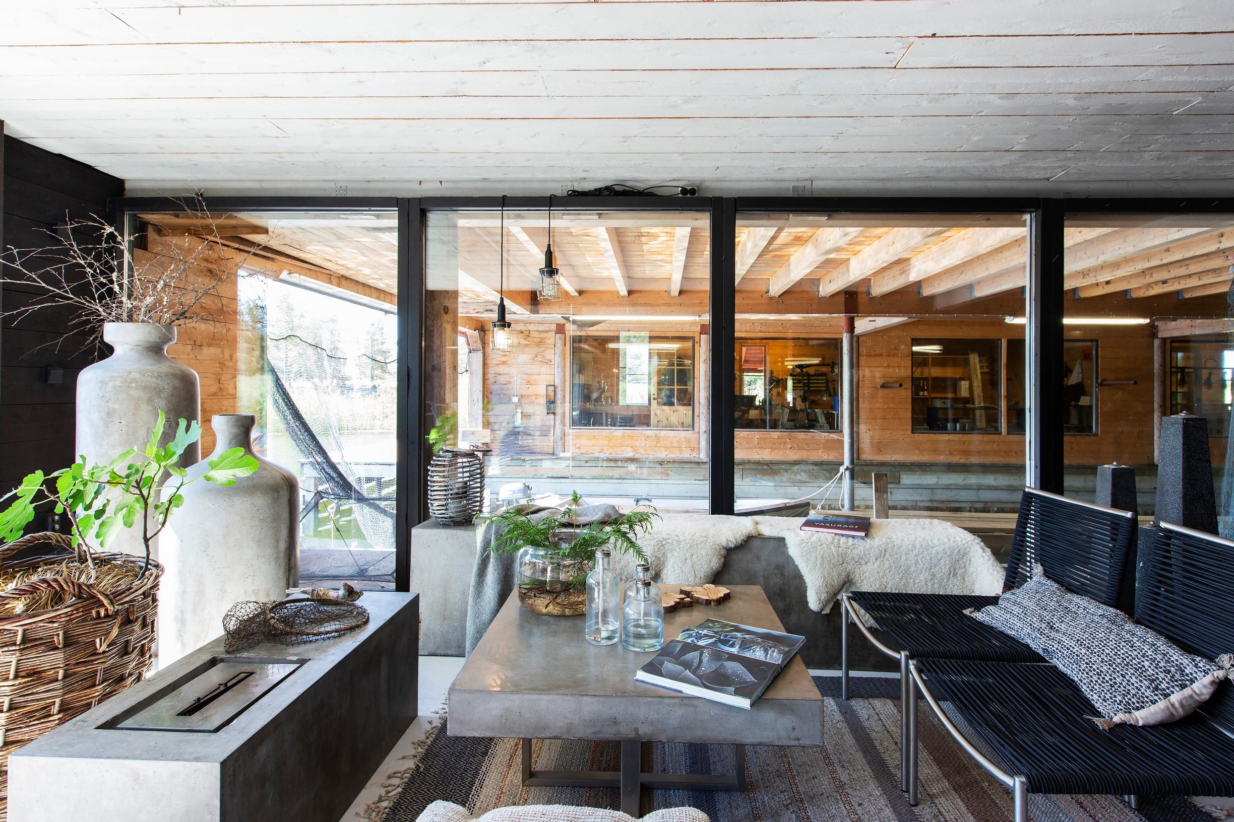 Concrete furniture and soft textiles in the downstairs living area.