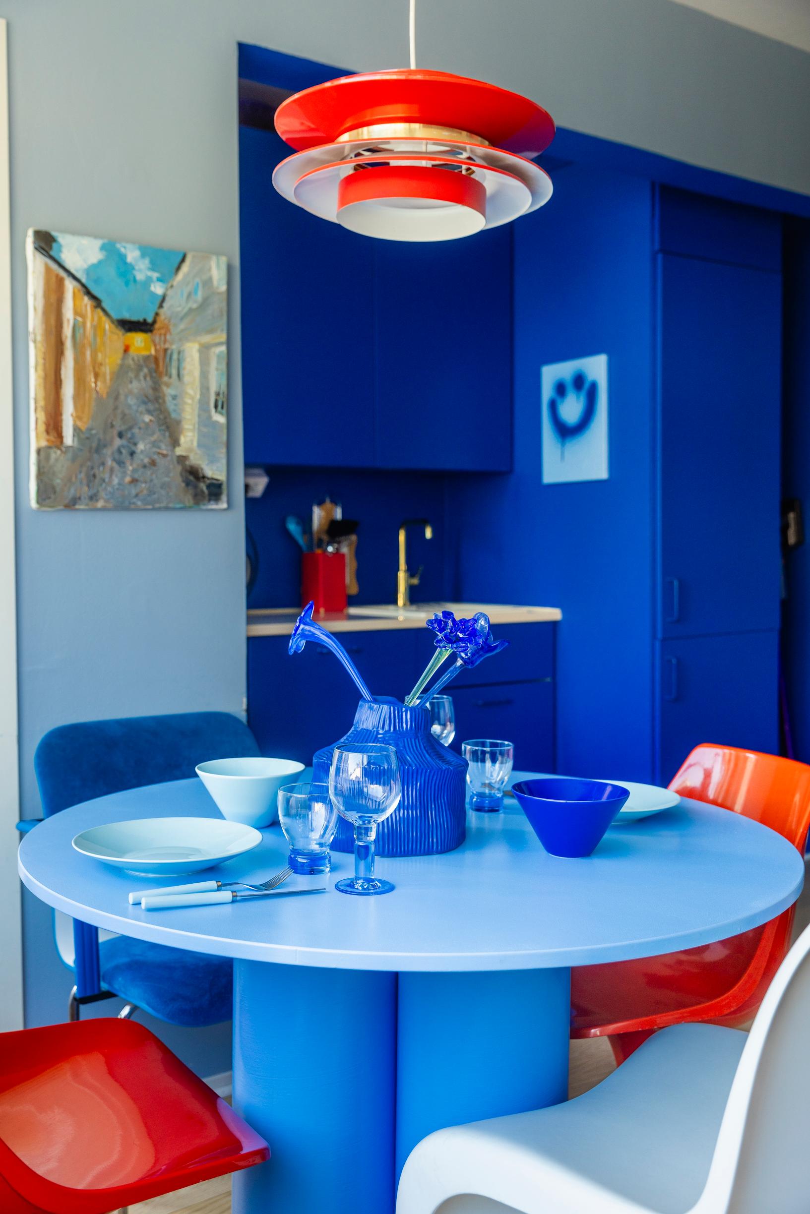 a blue table in a blue kitchen