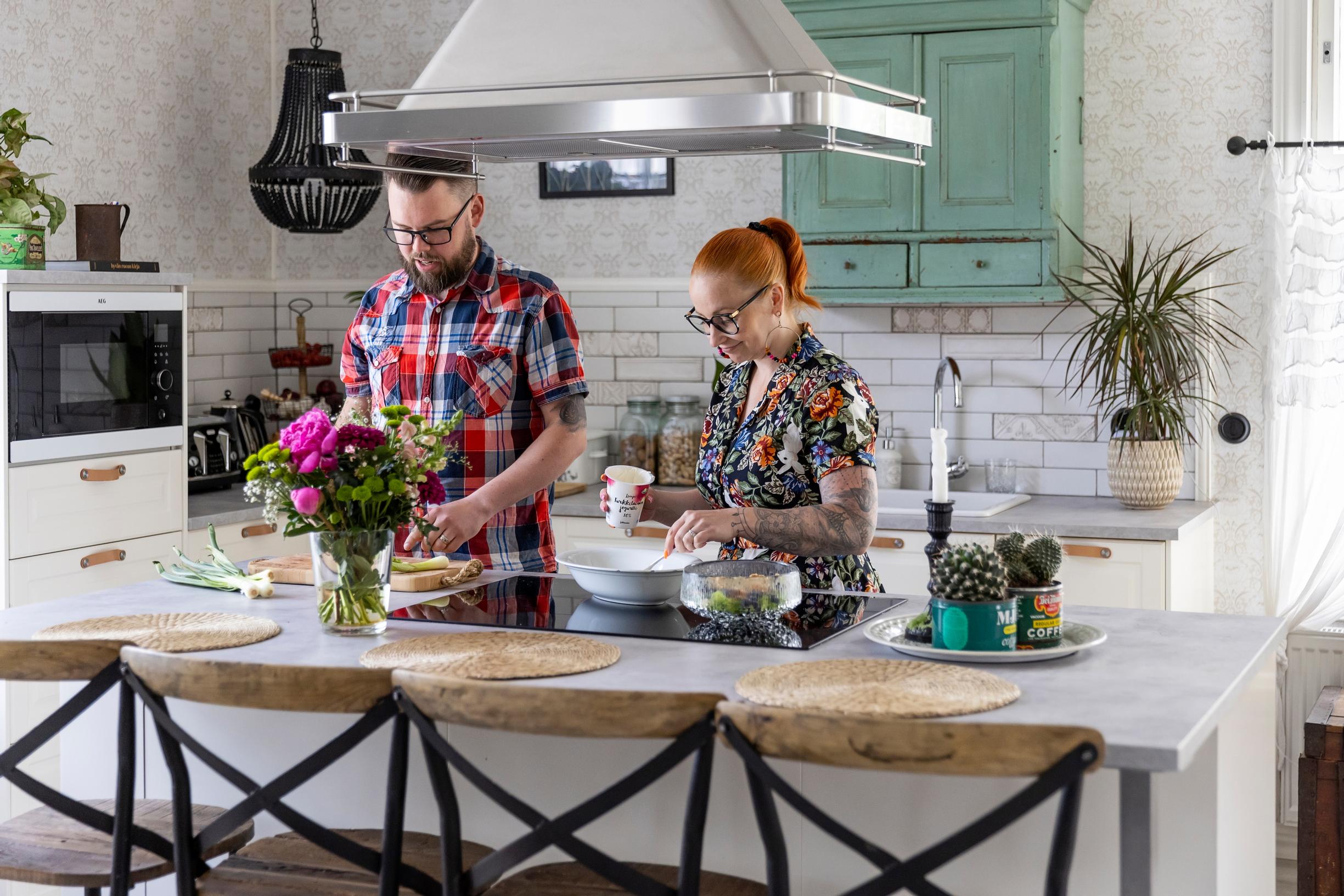 Sami and Hanna-Riikka cooking together