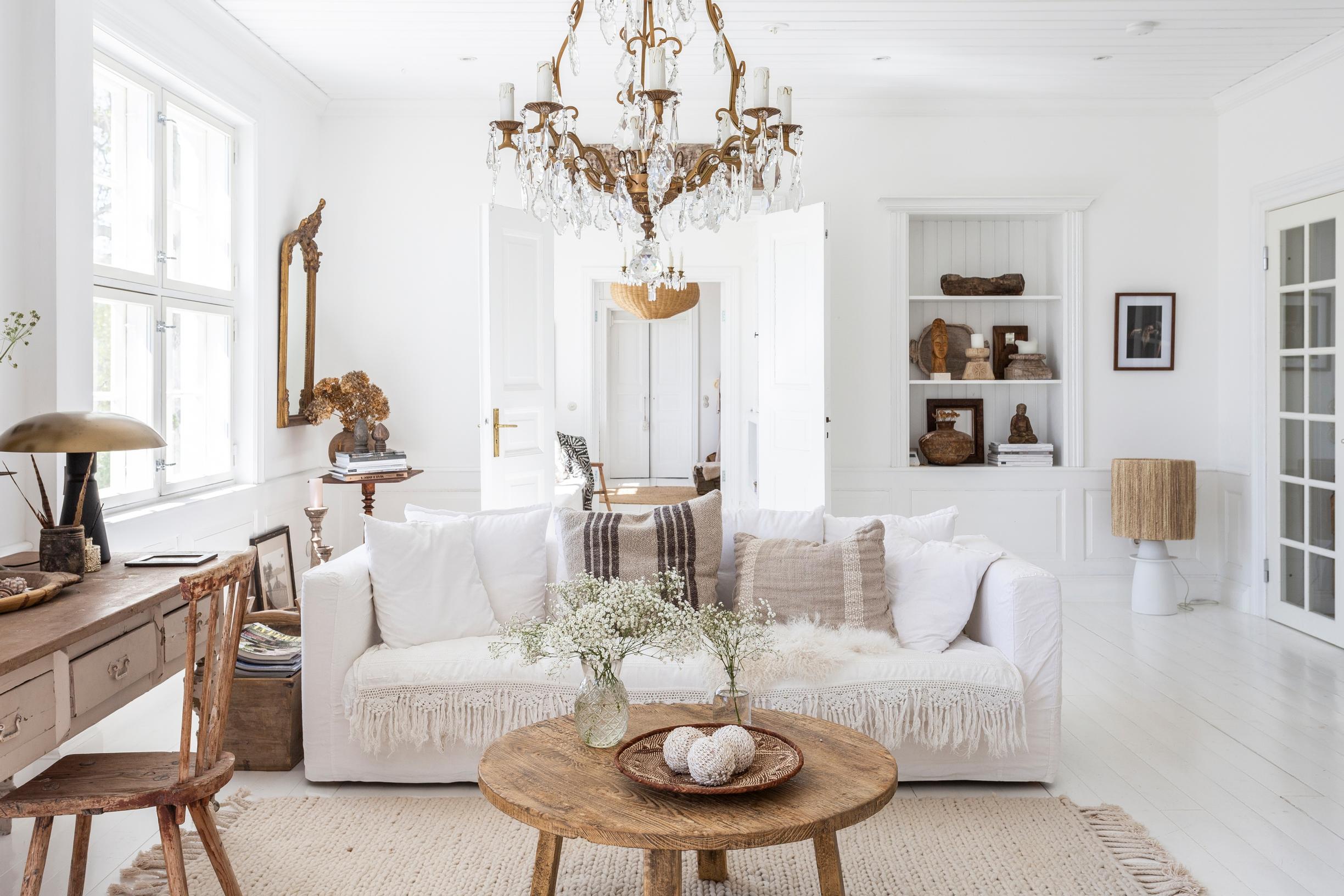 Spacious living room with a sofa and two plush armchairs