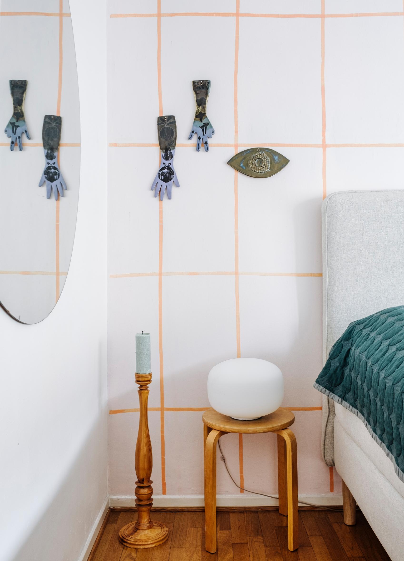 A thin, hand-painted grid on a white wall.
