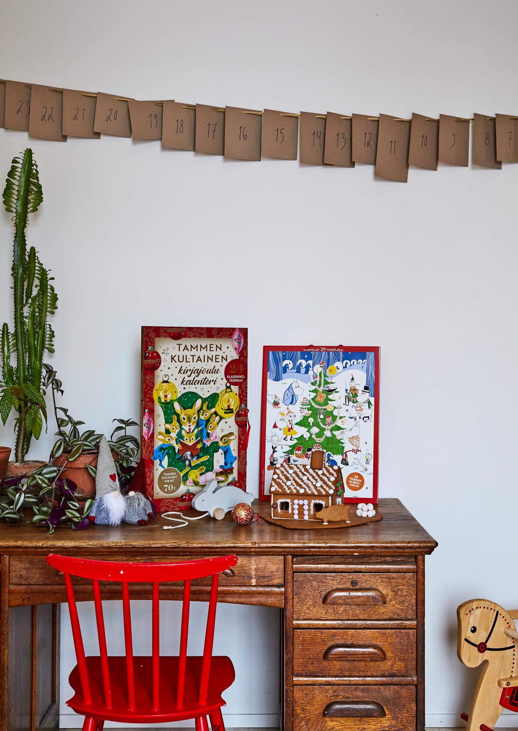 Handmade advent calendar hangs above the desk.