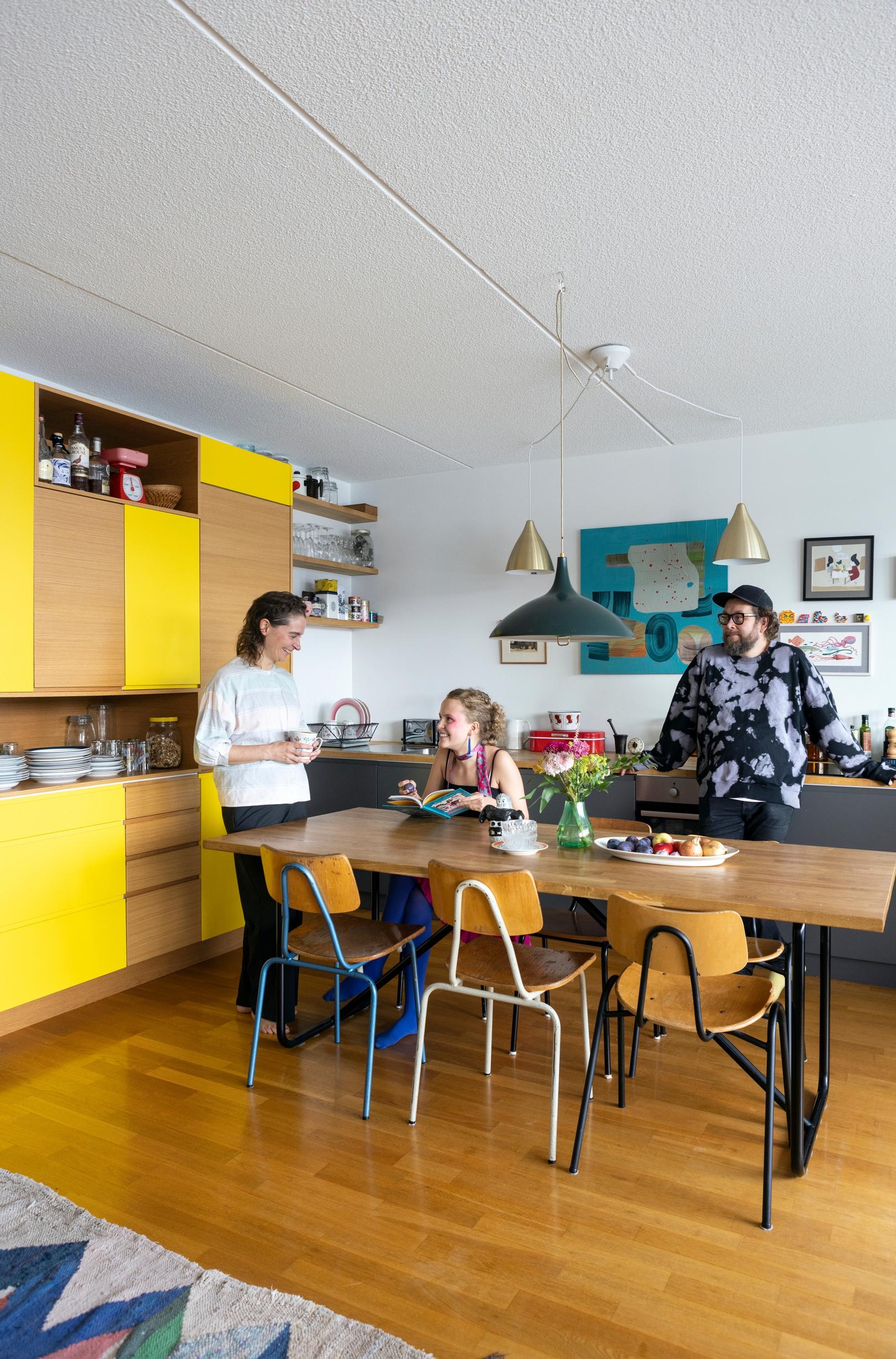 The family in their yellow kitchen