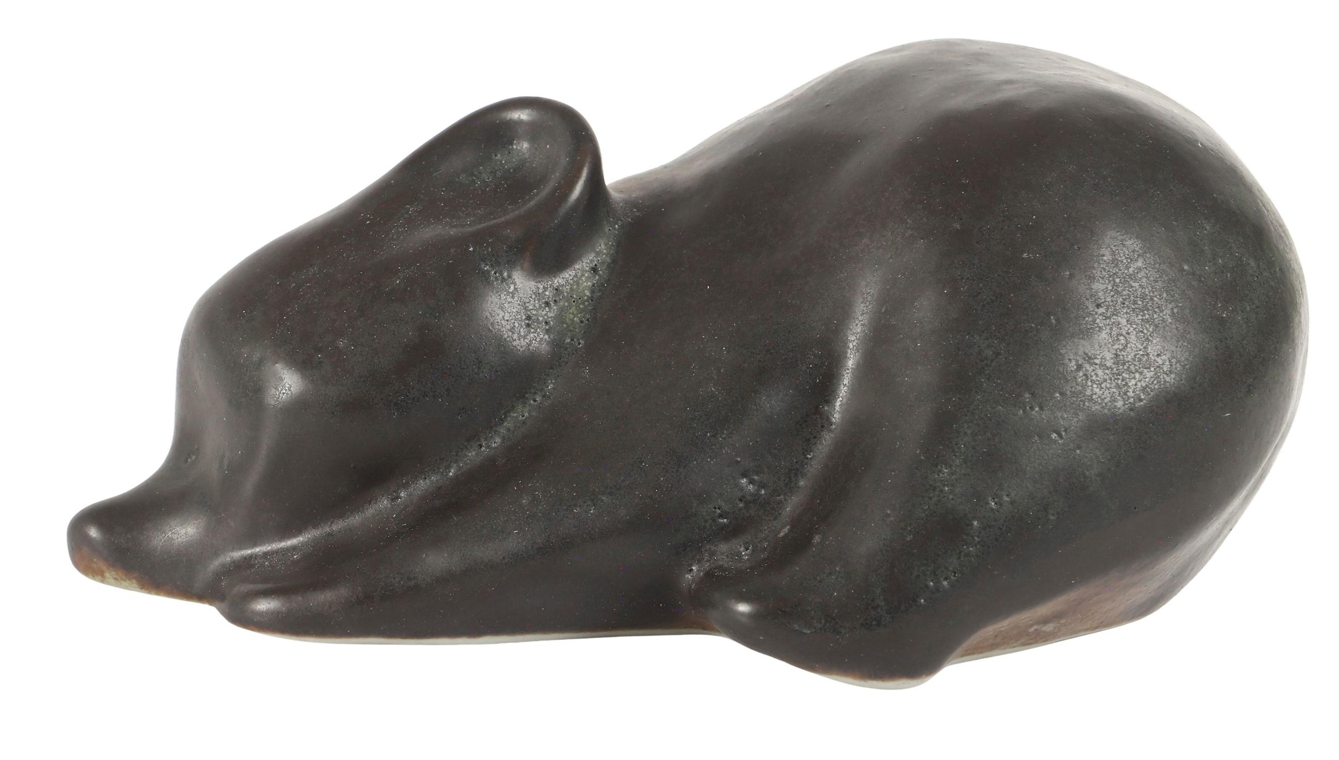 A small bear figurine by Richard Lindh