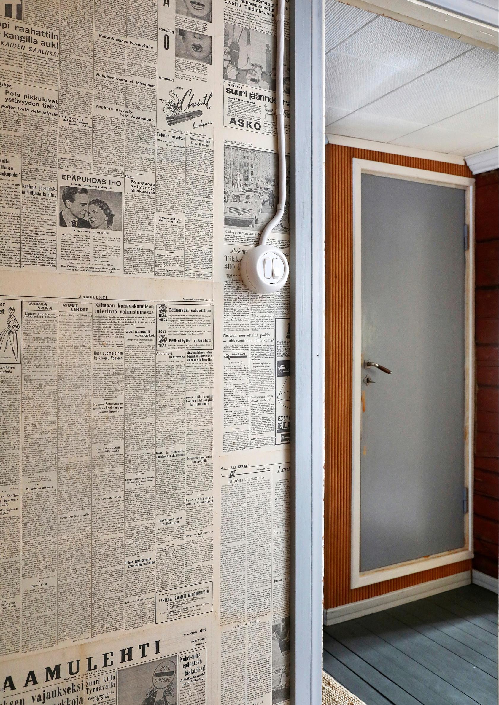 A wall covered with old newspaper pages