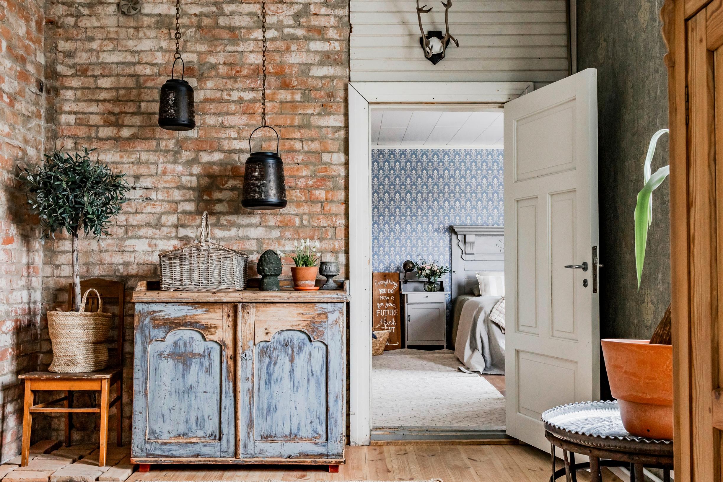 exposed brick walls and wooden floors