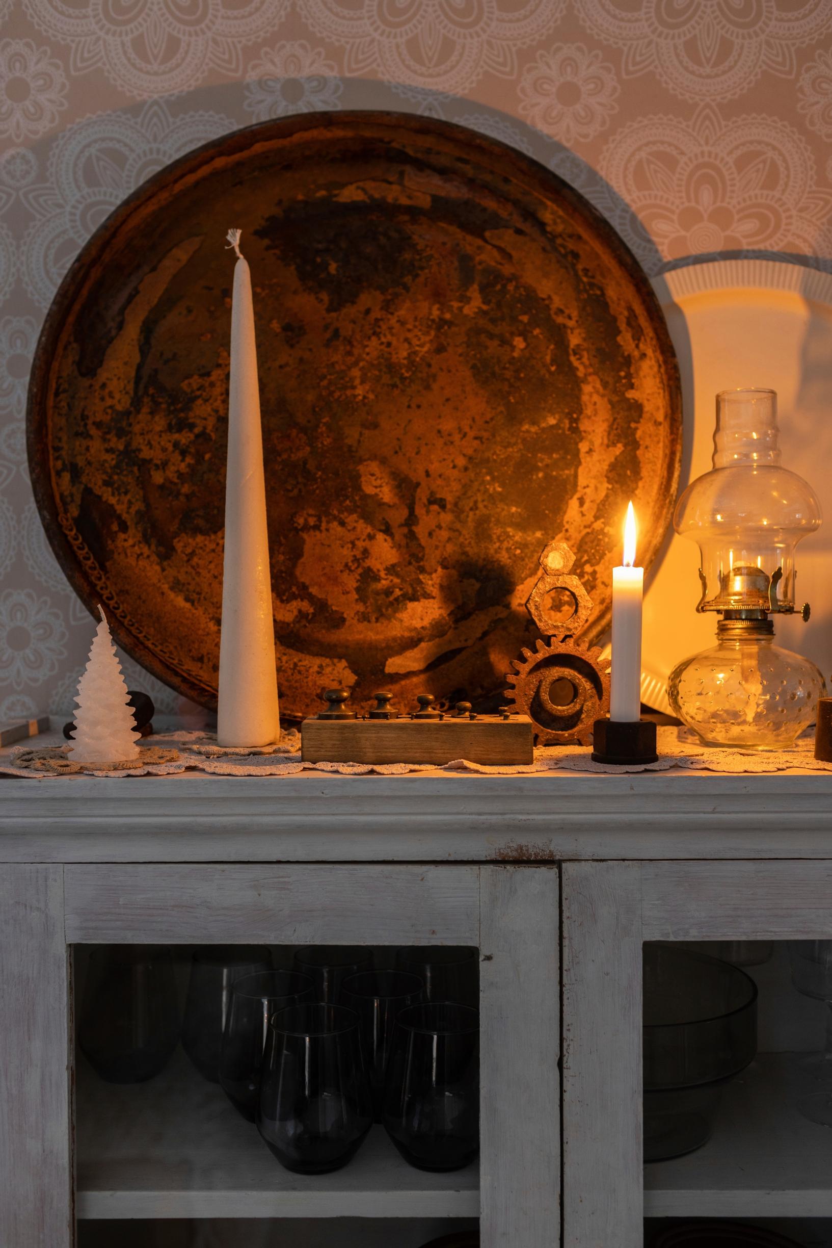 A Christmas arrangement with candles.