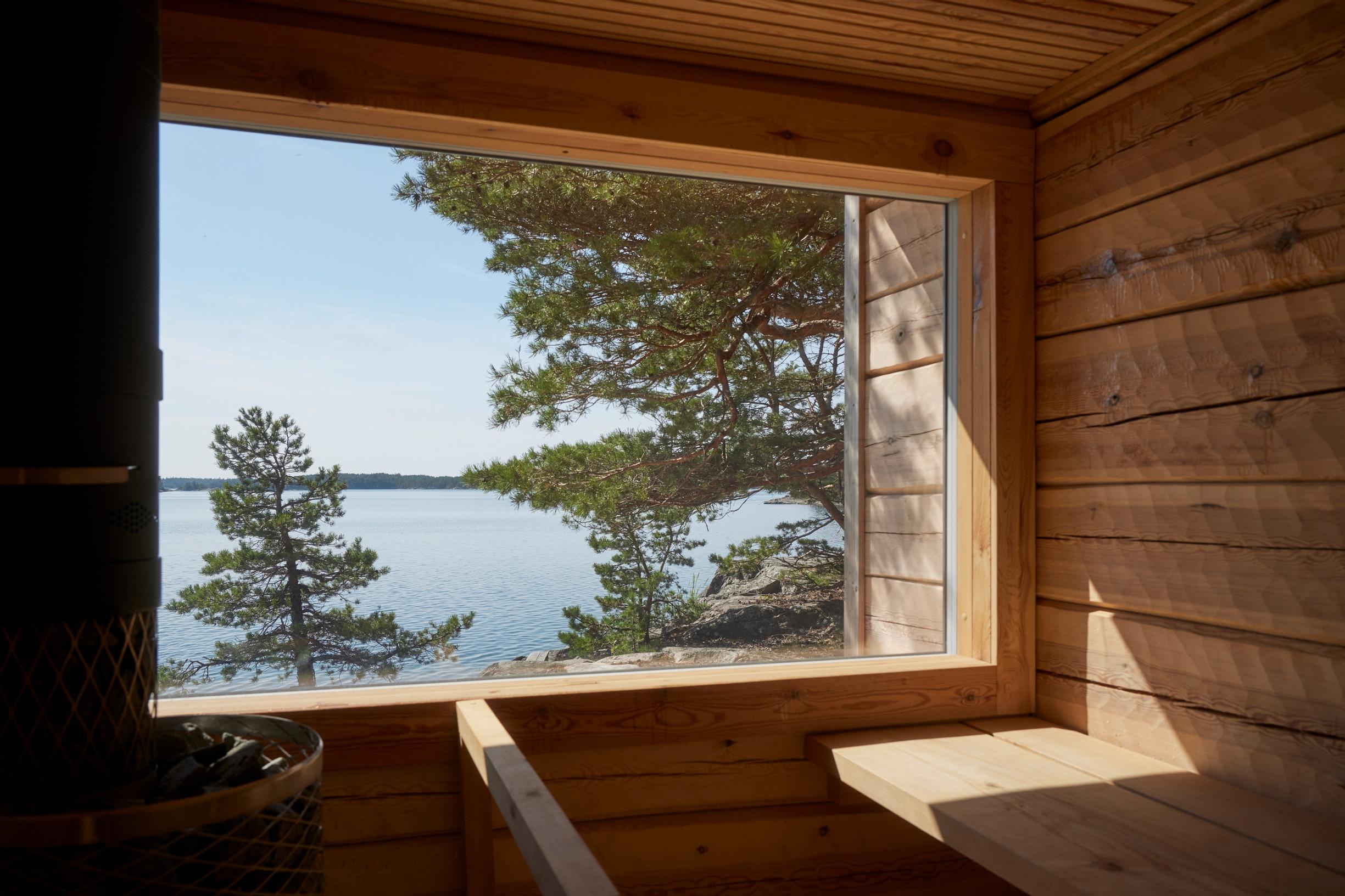 Sikke’s sauna with a panoramic window and alder benches.