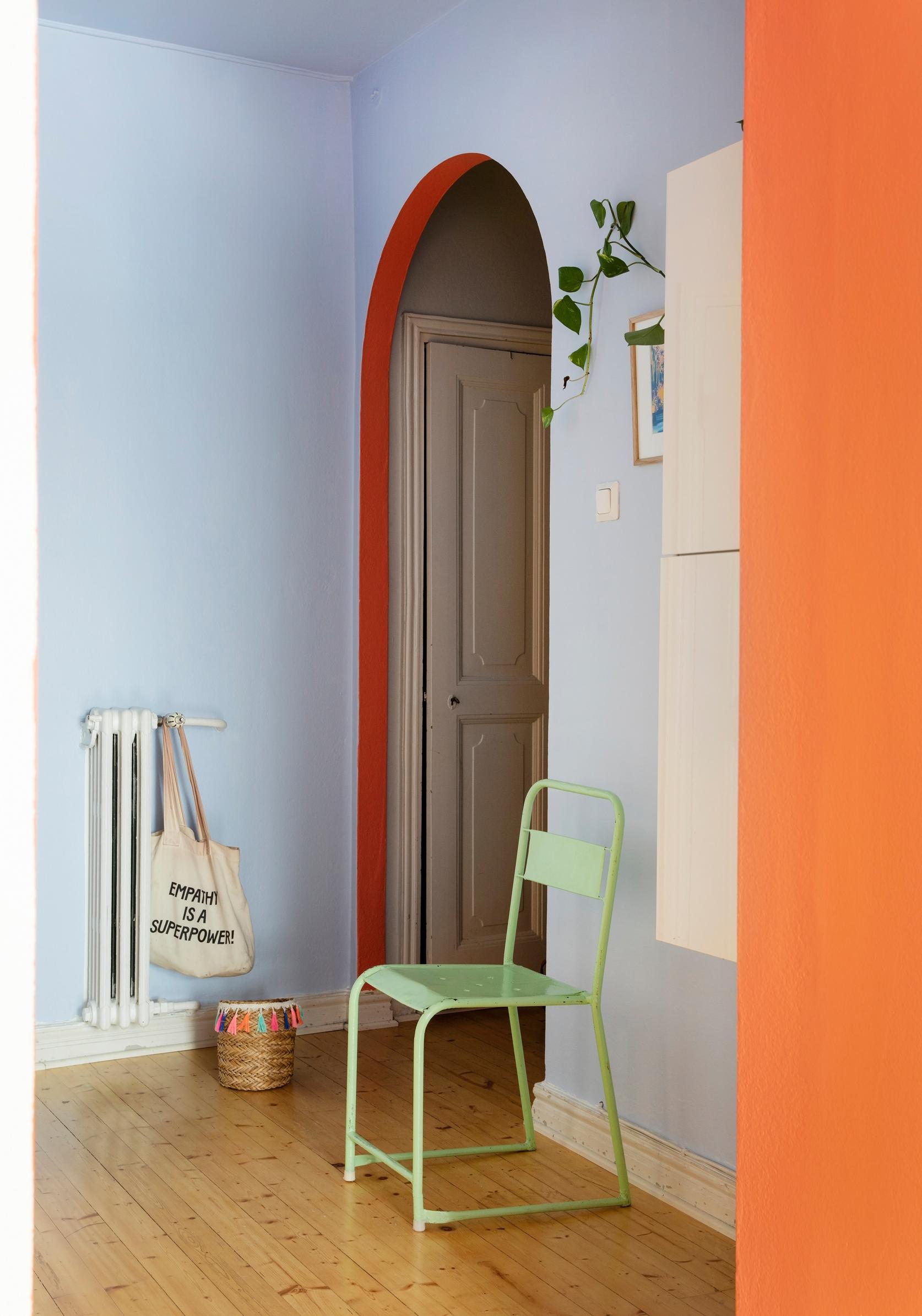 A curved interior doorway painted bright red.