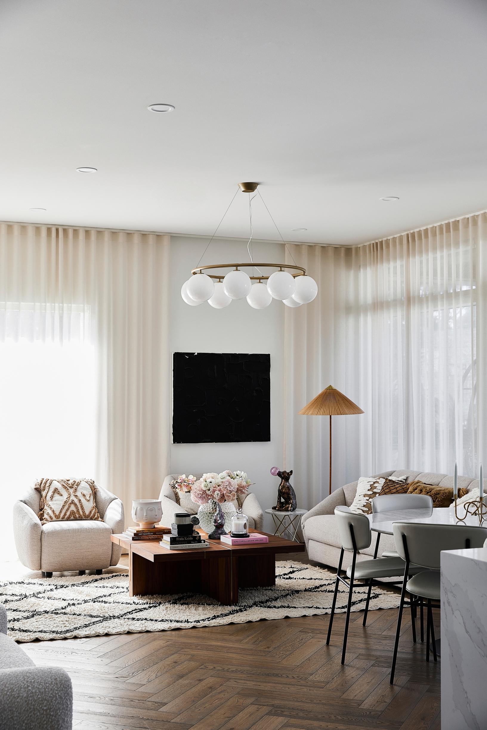 A living room with fairly dark herringbone parquet.