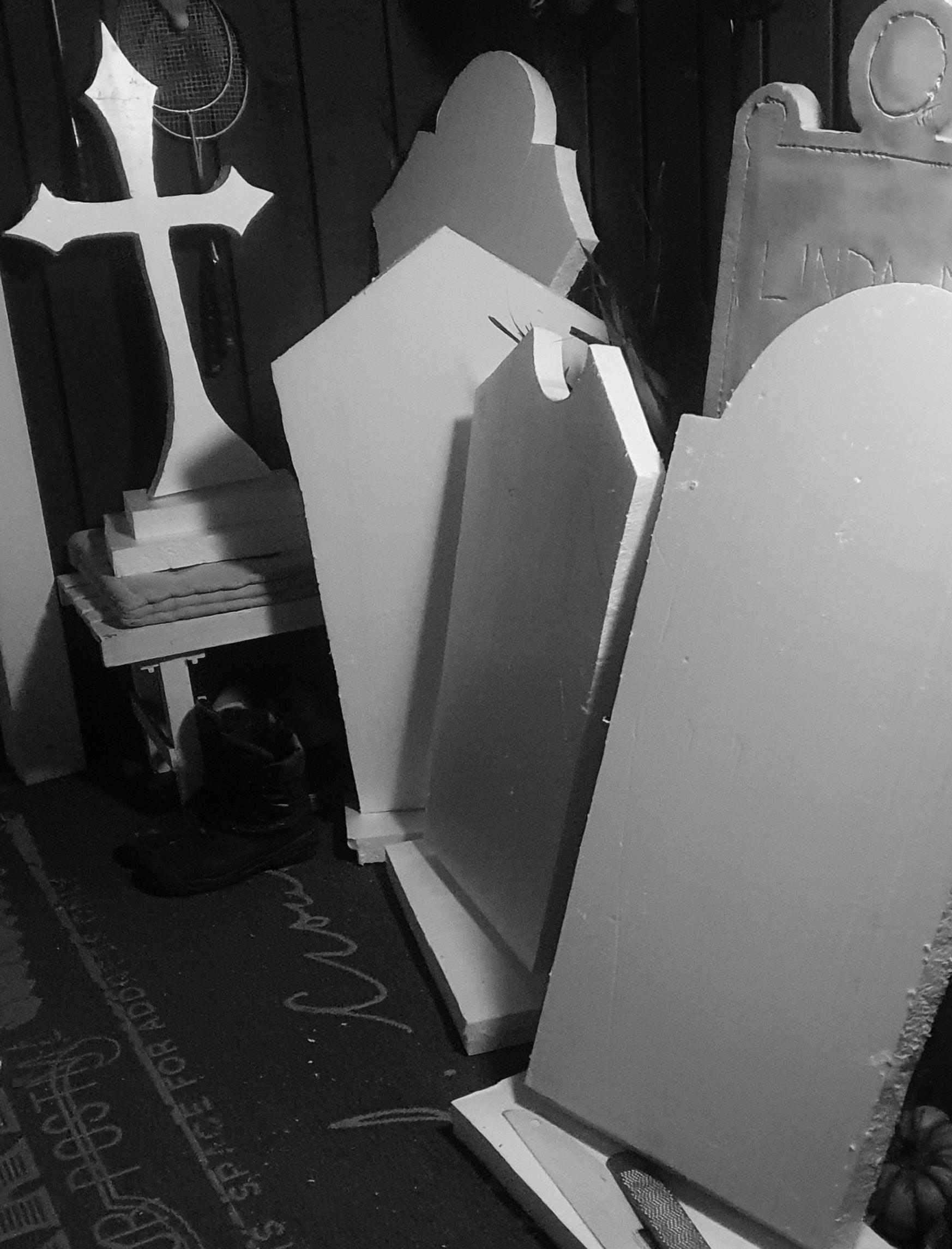 Decorative tombstones in storage.