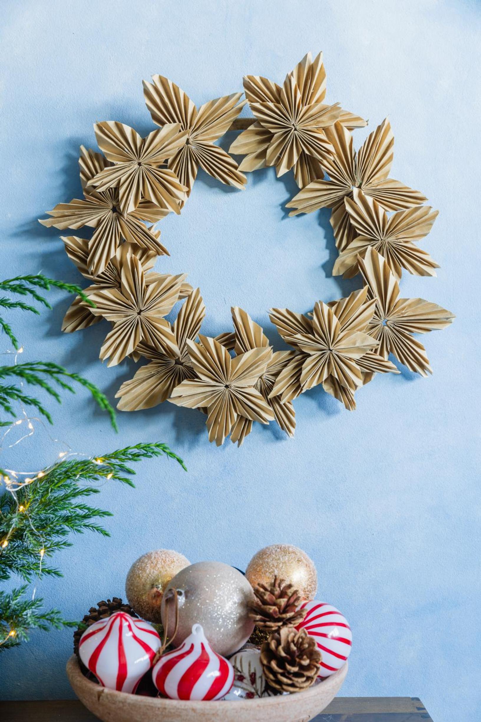 A wreath assembled from brown coffee filter stars.