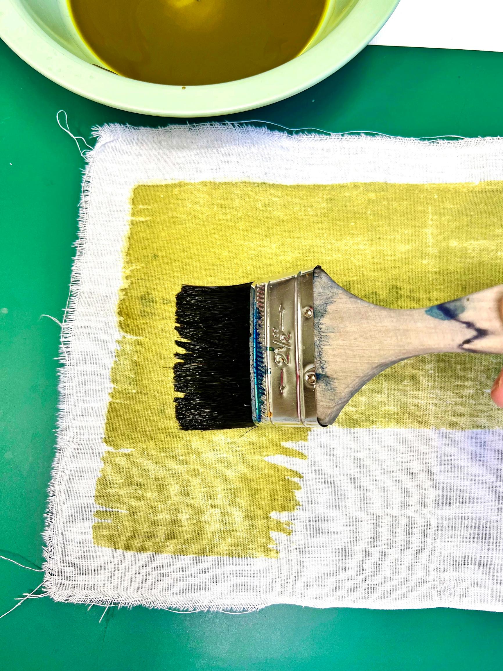 Brush the cyanotype sensitizer onto the fabric.