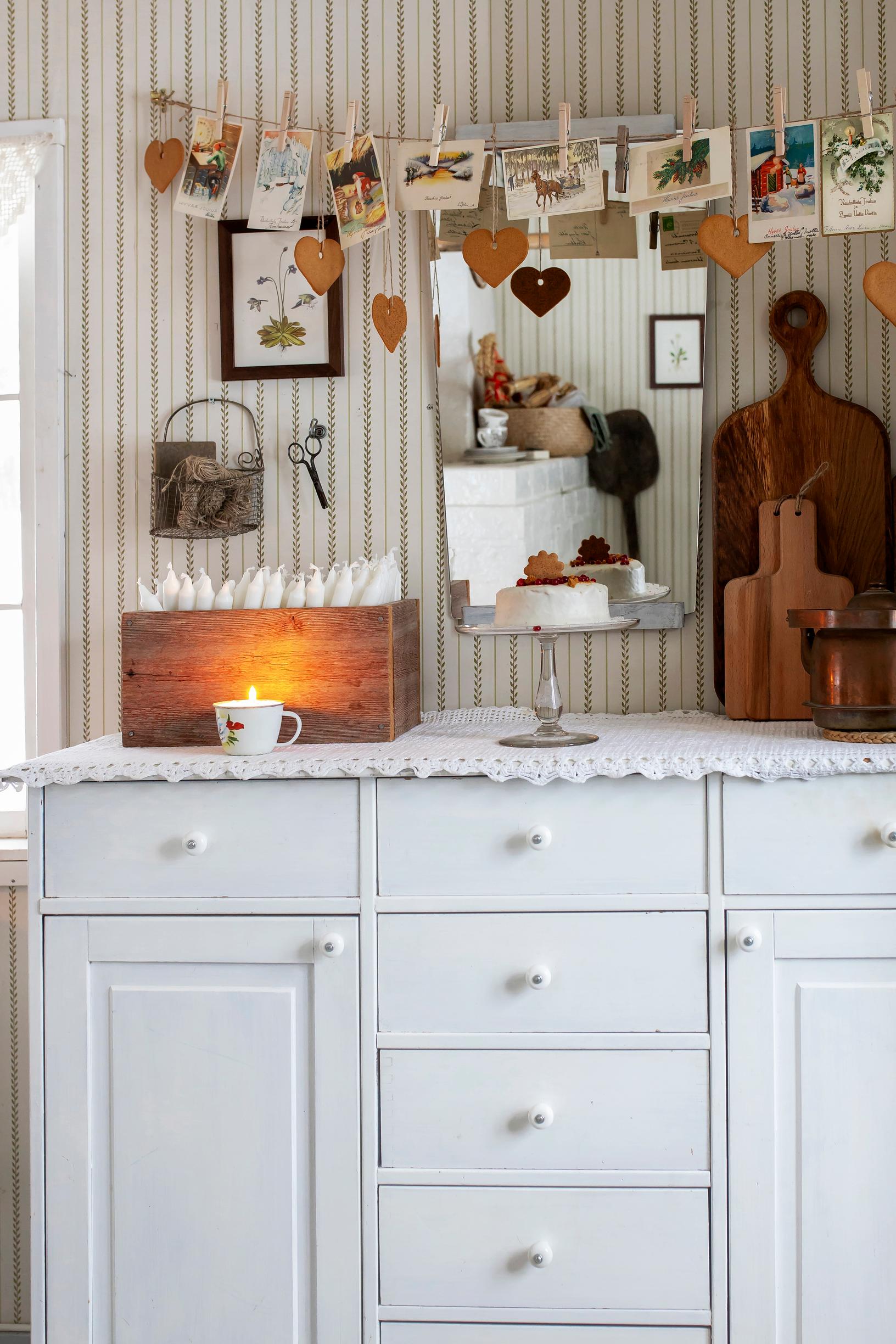 Christmas items on a white sideboard.
