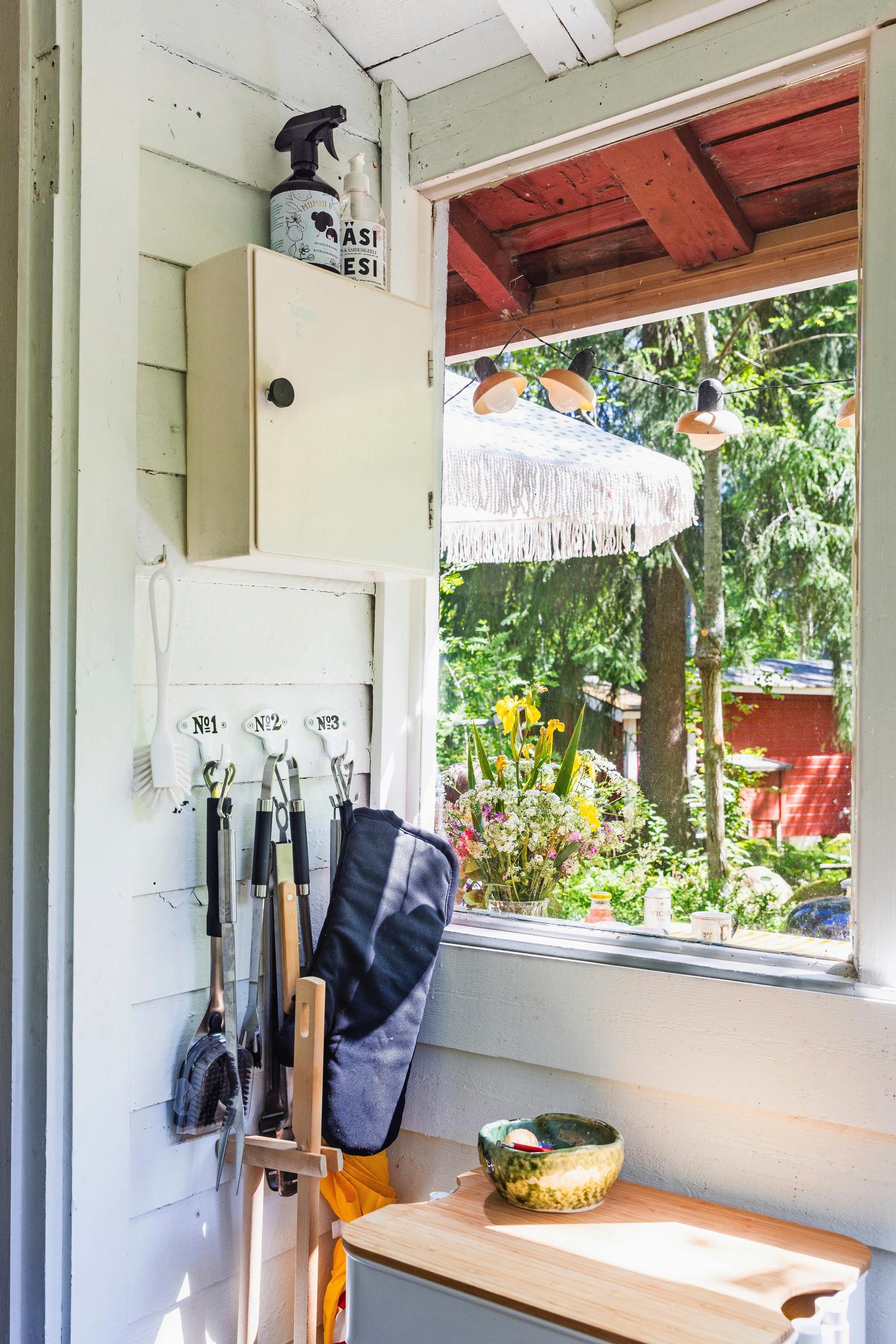 a medicine cabinet, window, and grilling tools